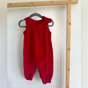 Baby gap 6-12 red jumper with bow . Buttons on bottom for easy diaper change.